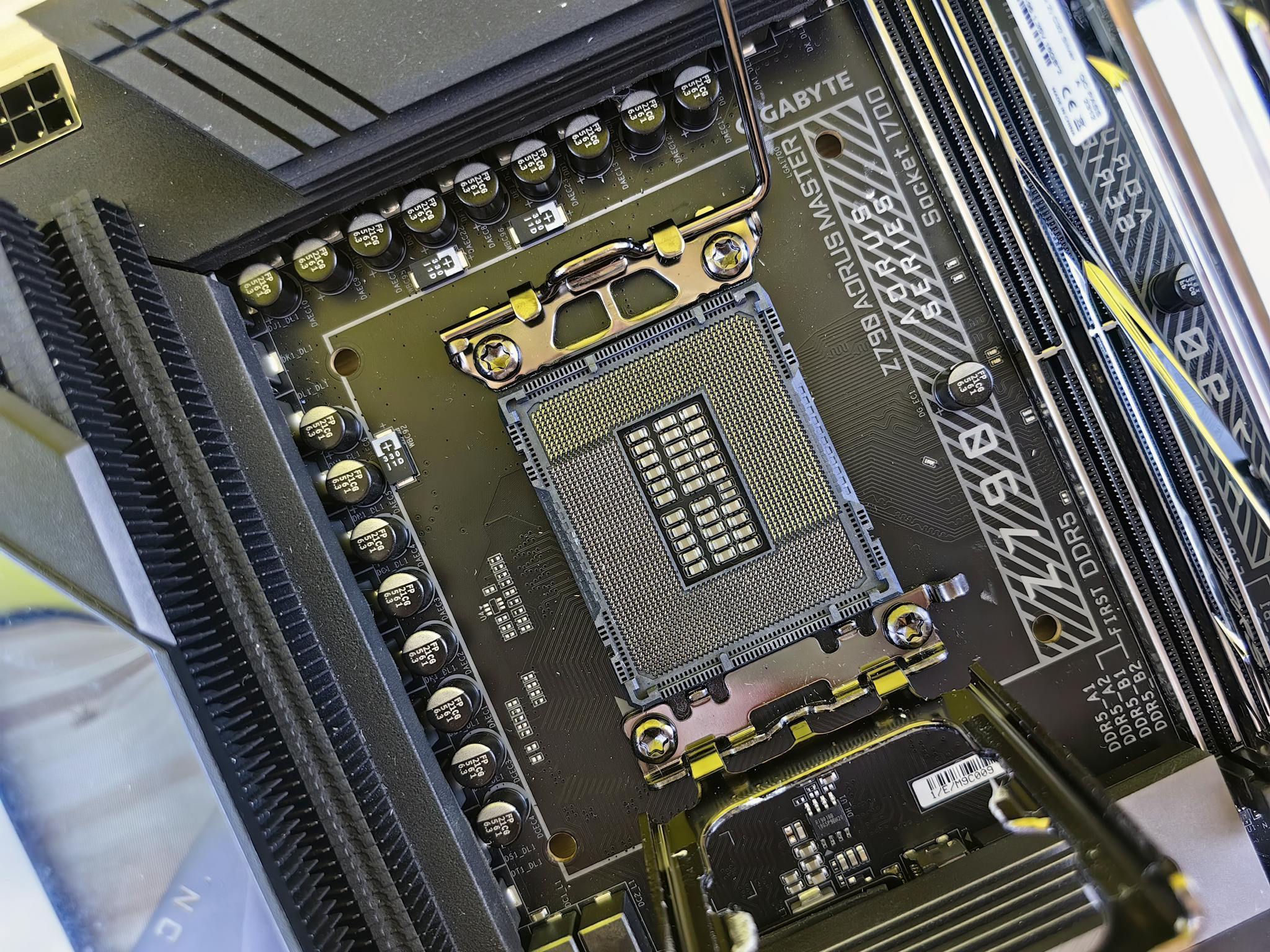 Detailed view of a computer motherboard socket showcasing advanced electronic components and technology.